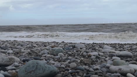 February-2022-storm-Eunice-splashing-waves-on-English-pebble-stone-beach