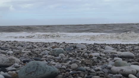 february 2022 storm eunice splashing waves on english pebble stone beach