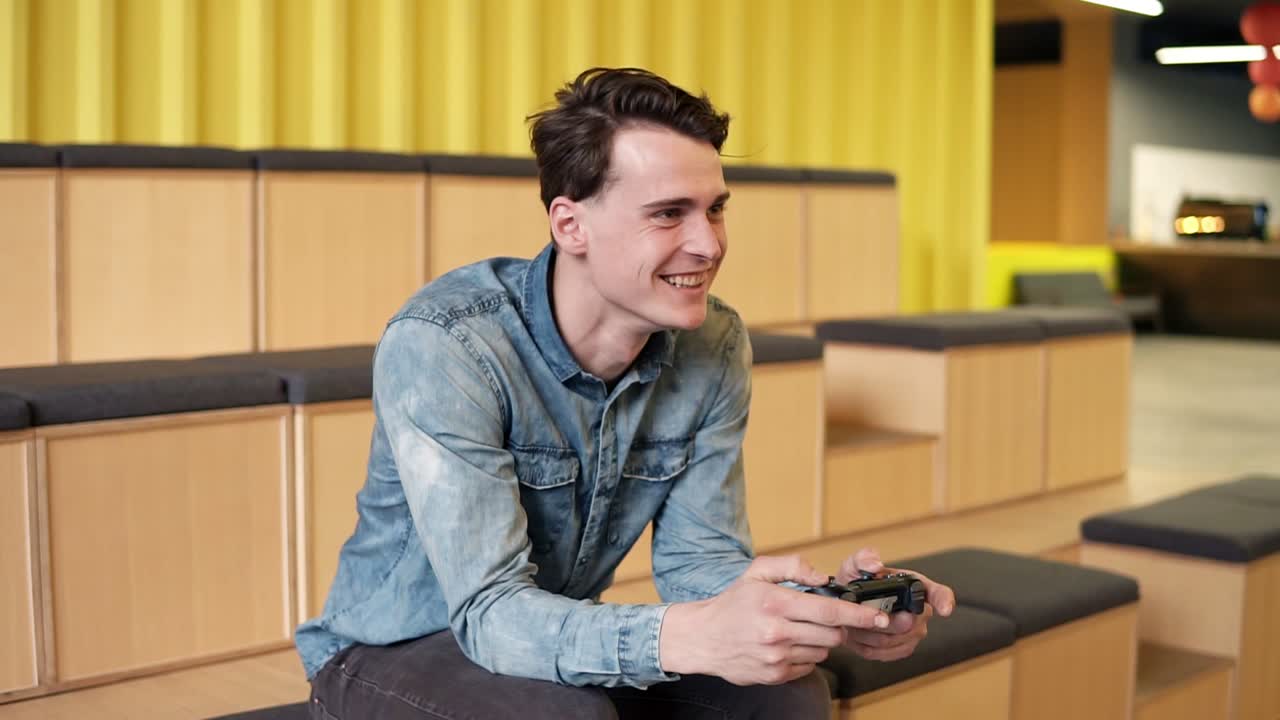 Attractive Sexy Young Guy In Denim Shirt Playing Video Games With Sincere  Excitement Free Stock Video Footage Download Clips Entertainment