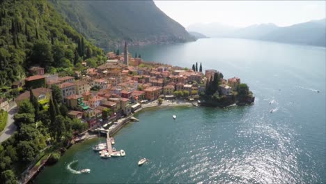 aerial drone footage over the beautiful town of varenna, lake como, italy