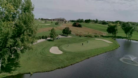 drone shot from profile to above on golfing gree