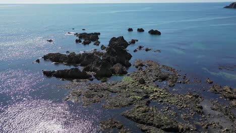 Aerial-view-of-rocky-coastline-and-clear-water-in-the-South-of-Ireland