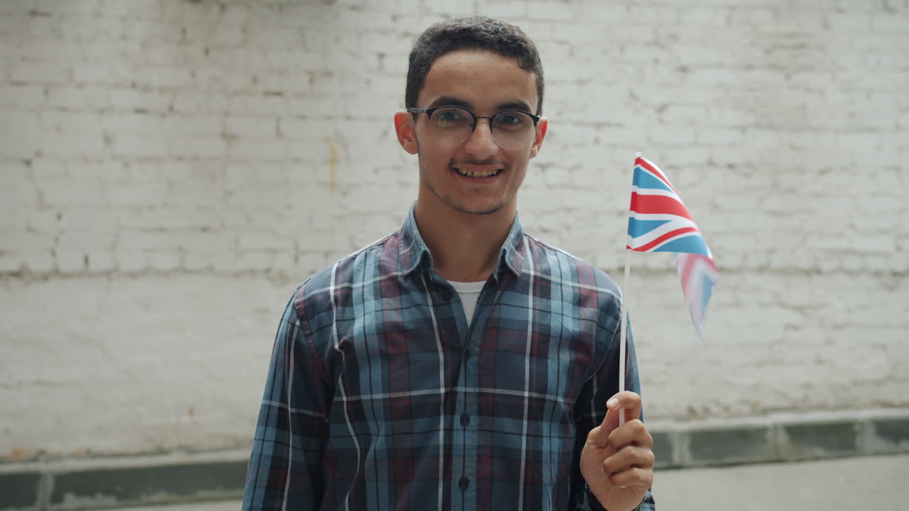 Young Man Holding a British Flag