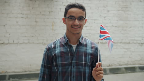 young man holding a british flag