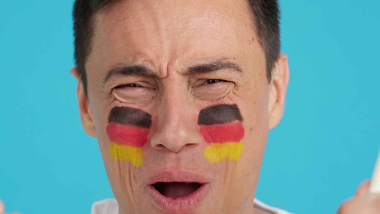 Close up of a man supporting german team