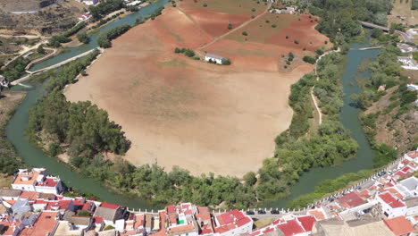 AERIAL---Farmland-in-Arcos-de-la-Frontera,-Cadiz,-Spain,-wide-spinning-shot