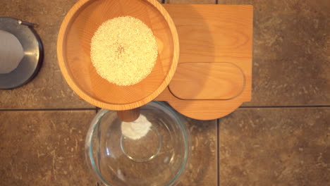 grinding rice grain to flour for natural, organic and gluten-free recipes for helathy living - top down view