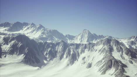 snowy mountain landscape during bright daylight in a remote region