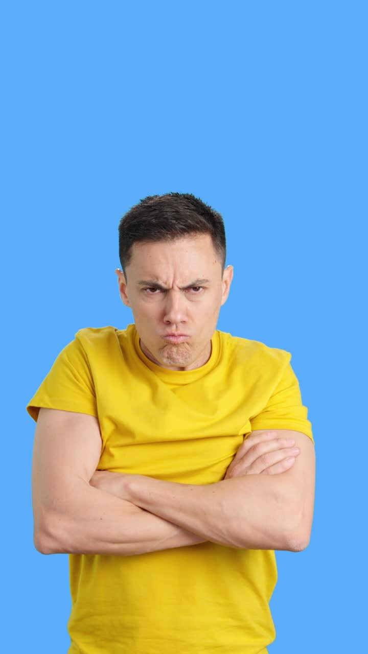 An angry man with his arms crossed