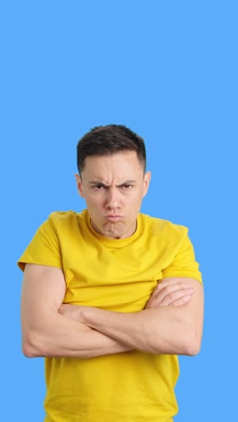 an angry man with his arms crossed