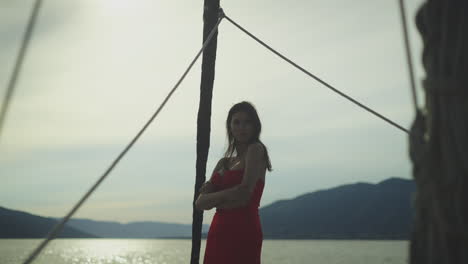 woman in red dress on a boat