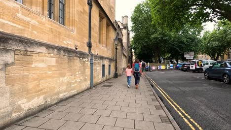 people walking on a historic oxford street