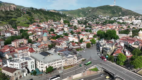 cars driving over the metekhi bridge in the city of tbilisi, georgia