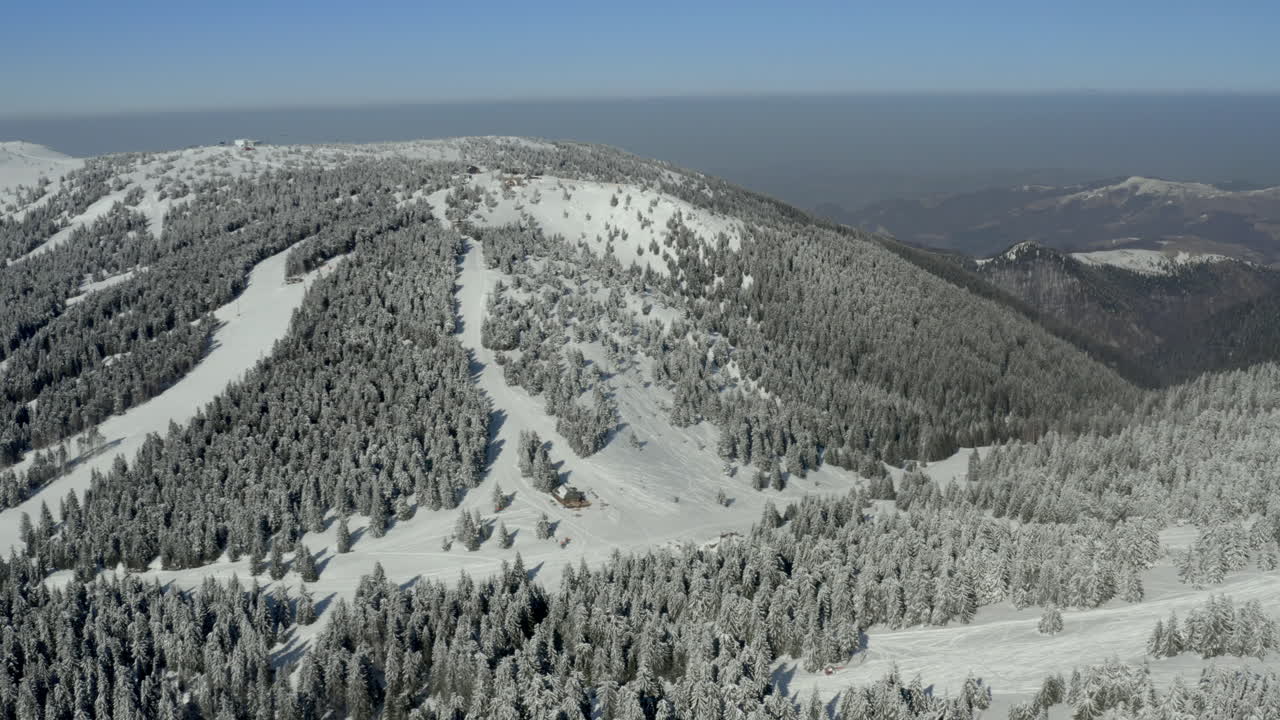 Aerial View of Snowy Mountain Ski Resort in Winter
