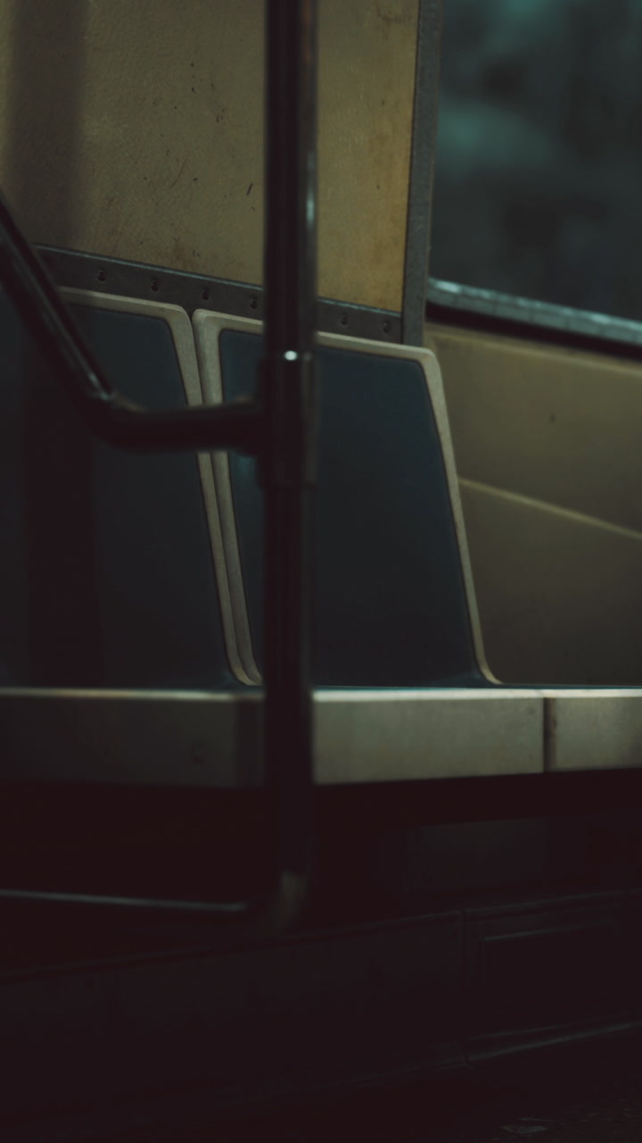 Empty subway car embraces shadows during late night ride