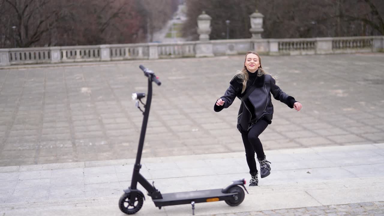 Woman Riding an Electric Scooter in a Park