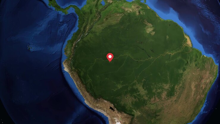Digital globe rotates and zooms into South America, pinpointing Leticia with geographic data overlay