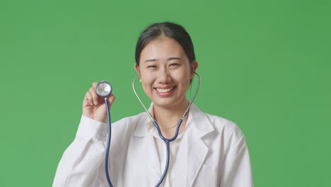 smiling asian woman doctor with stethoscope