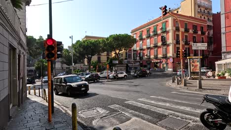 traffic and pedestrians at a bustling street corner