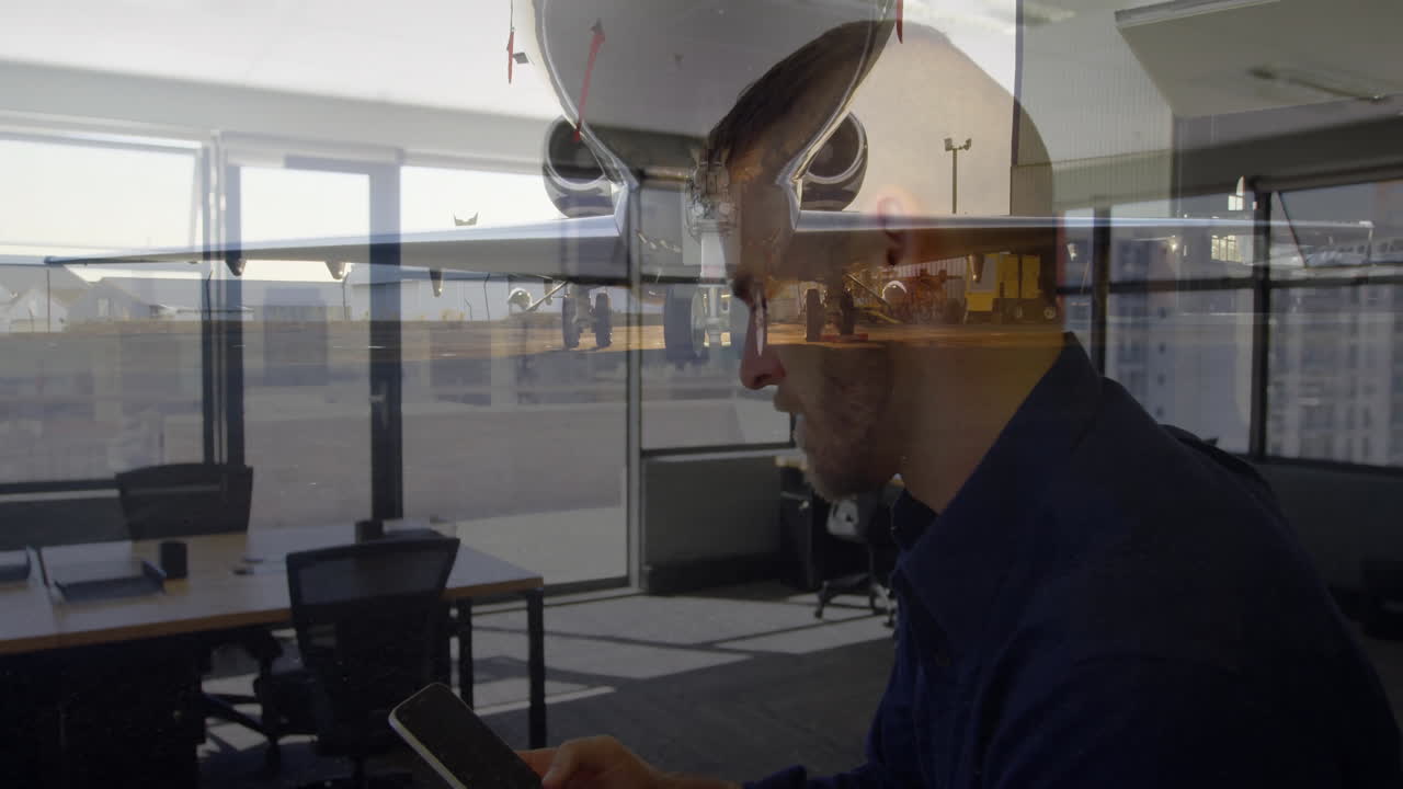 In office, animation of airport runway overlaying silhouette of man