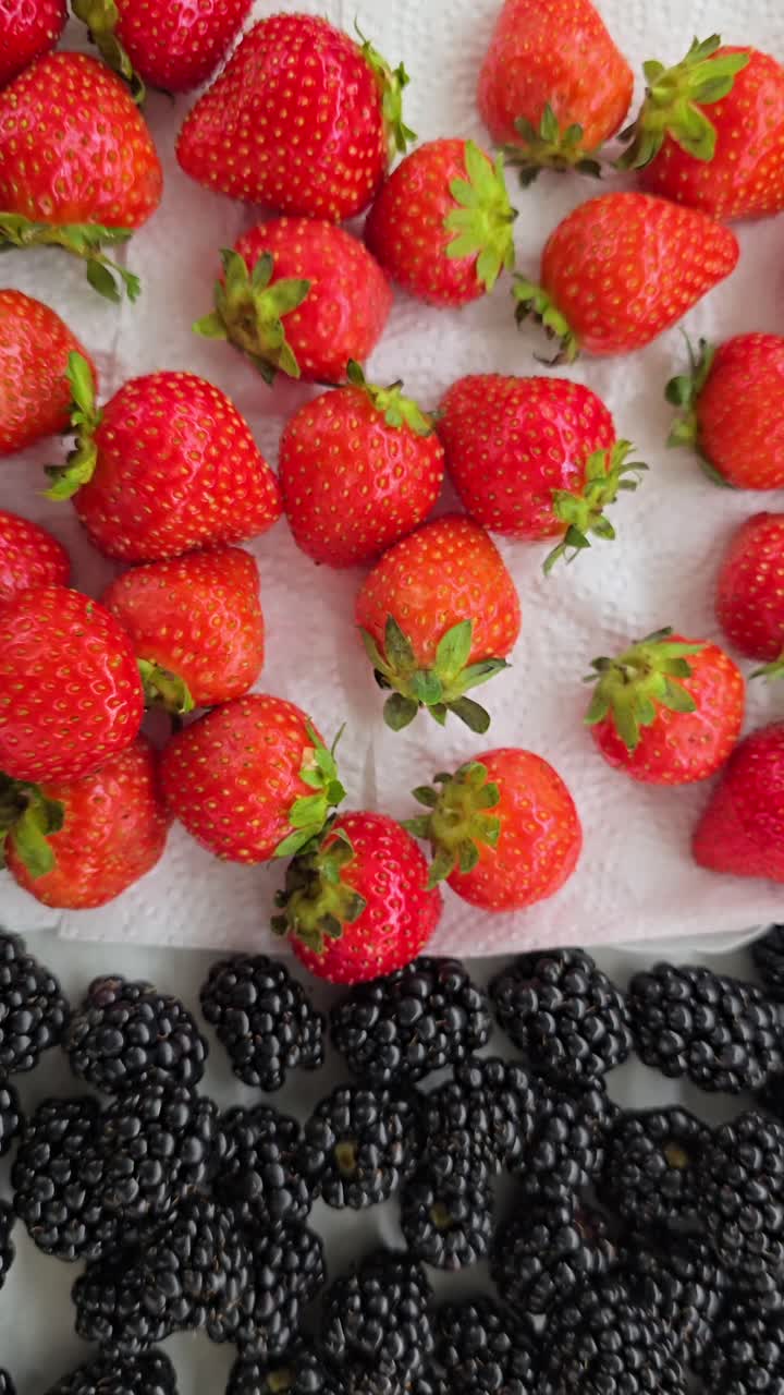 A vibrant collection of berries ready for cake and muffin toppings at a bakery shop.