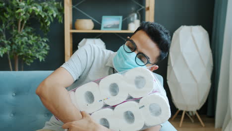 man exhausted from toilet paper stockpiling