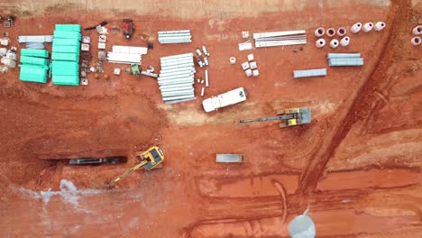 underground pipes and construction equipment from an aerial view