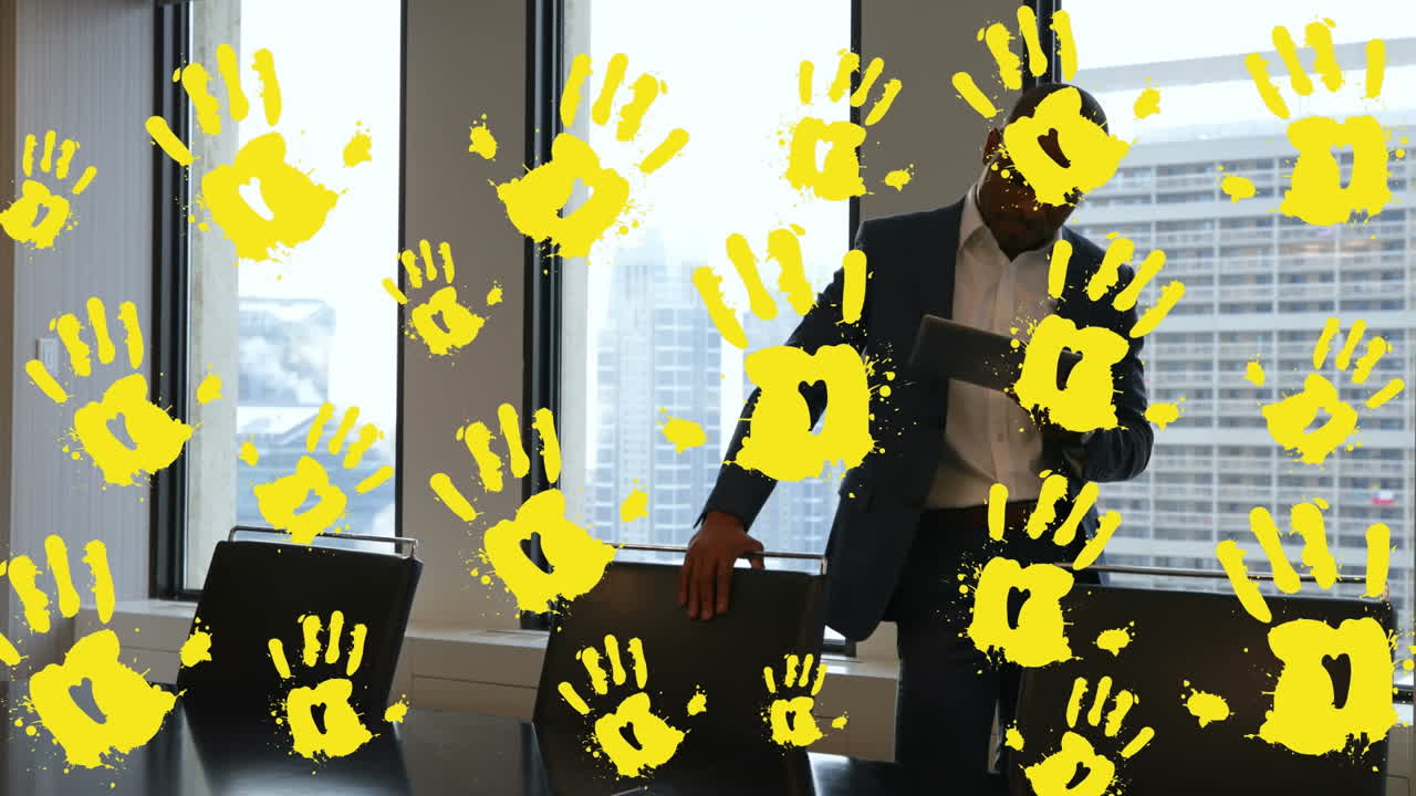 Animation von gelben Händen über einem kaukasischen Geschäftsmann im Büro.