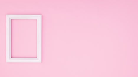 green leaf falling next to white romantic frame on pink theme. stop motion