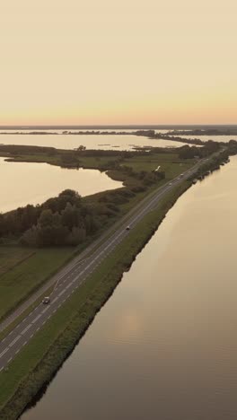 dutch canal and road at sunset