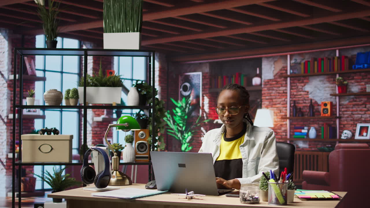 Freelancer in home office opening laptop, starting working on tasks