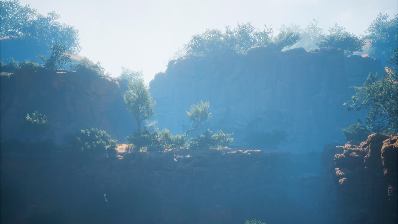 Misty morning light illuminating cliffs and trees in a serene landscape