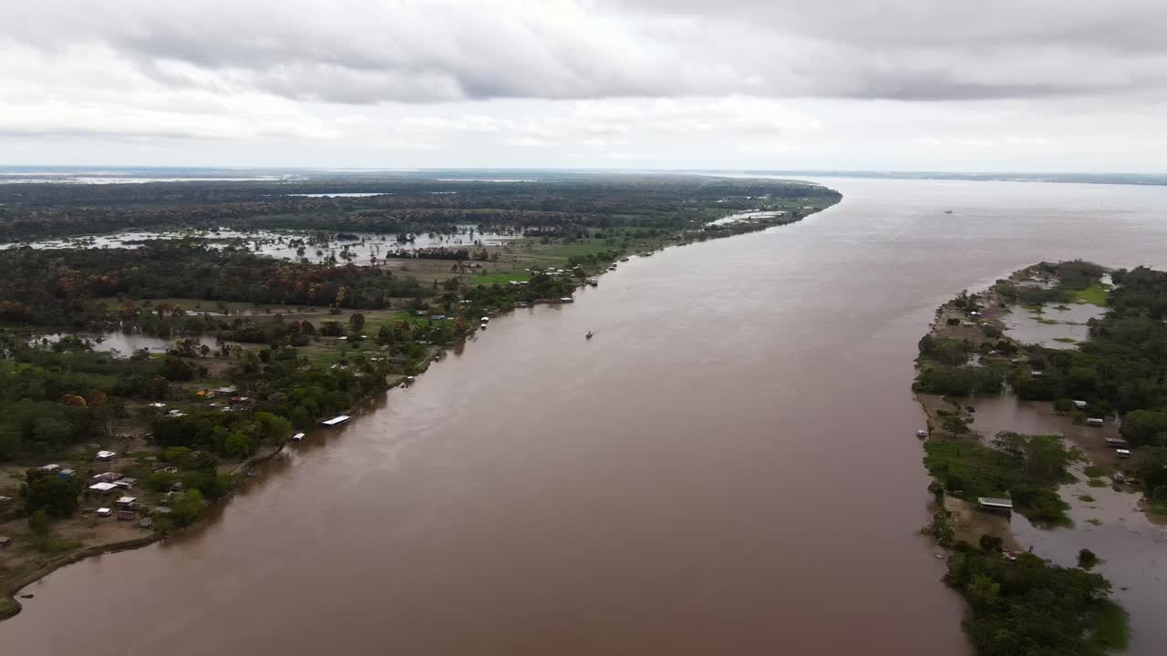 Aerial fly Rain Forest environment, Amazon River, wide waters in Manaus Brazil, Panoramic view