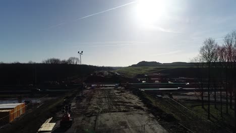 Aerial-push-in-drone-shot-of-a-construction-site