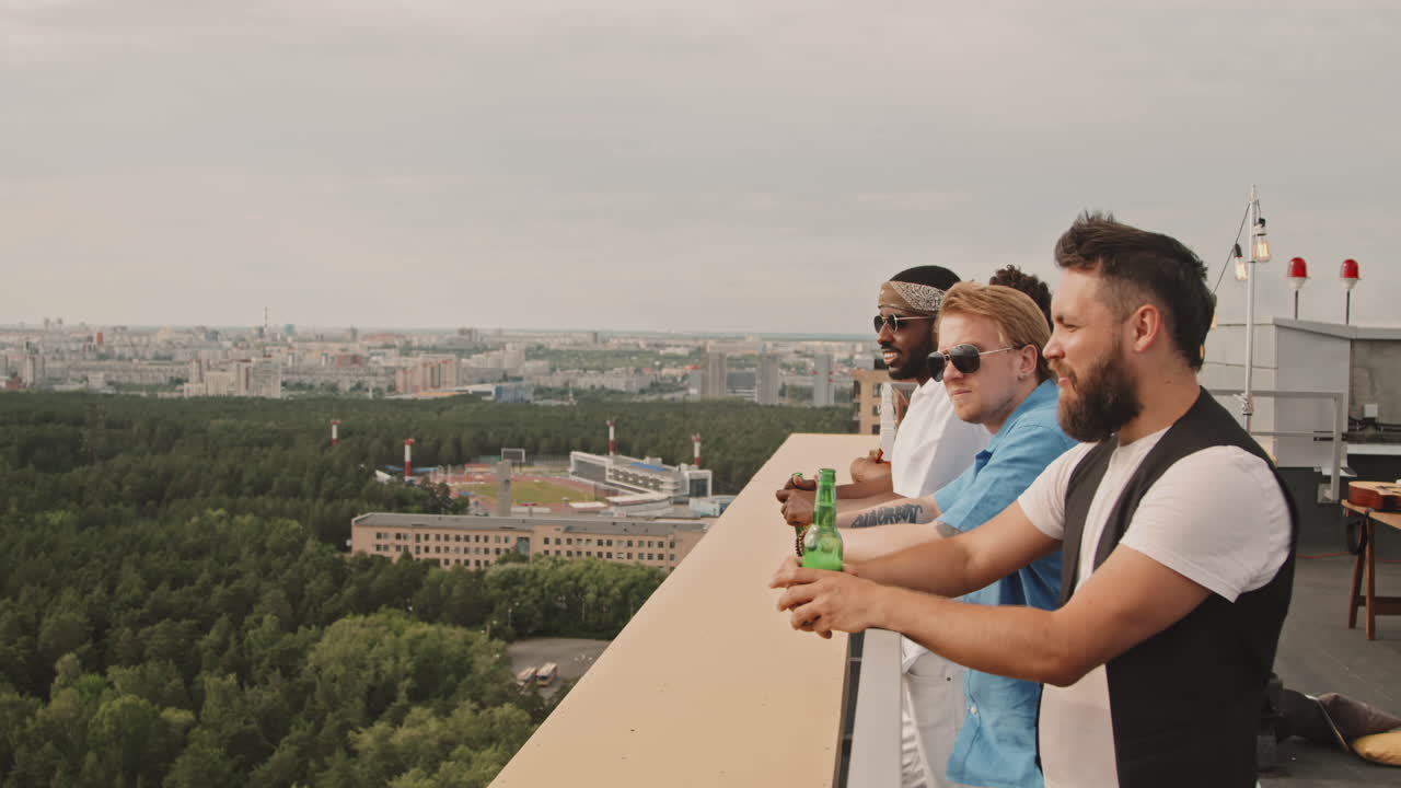 Friends Enjoying View from Rooftop Terrace