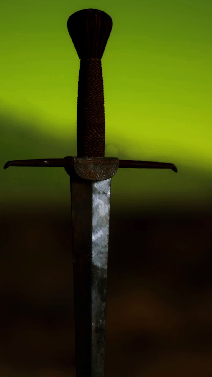 Sword embedded in rock under a glowing green sky during nighttime
