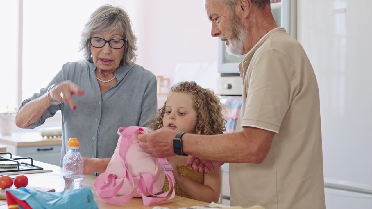 Grandparents packing lunch for grandchild