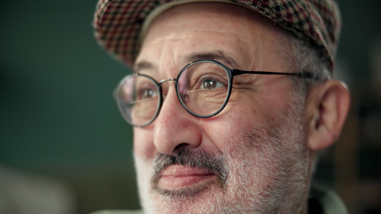 Portrait of a Senior Man with Glasses and a Hat