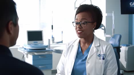 a healthcare professional engages in a conversation with a patient in a modern medical office, showcasing the importance of communication in patient care and wellbeing