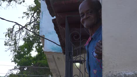 A-friendly-old-man-waves-gives-the-thumbs-up-and-smiles-in-Trinidad-Cuba