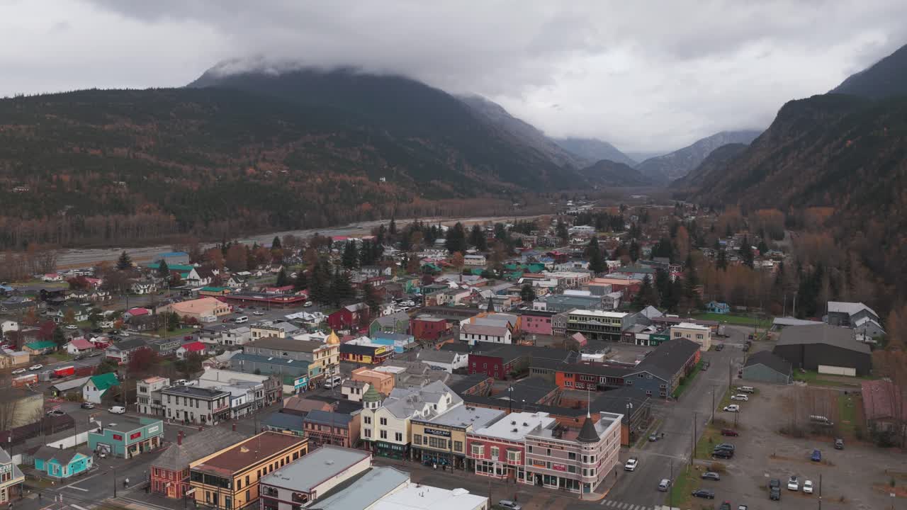 Aerial rising and panning shot of the historic port town of Skagway, Alaska in early autumn. 4K