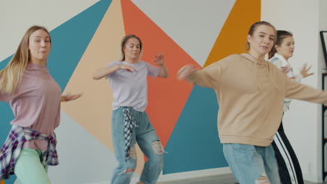 group of women dancing in a studio
