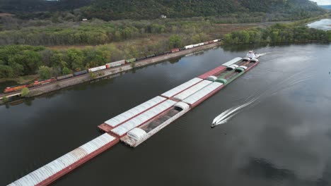 approaching lansing, iowa, a towboat pushing barges north on the mississippi river