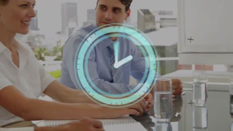 animation of digital clock over multiracial coworkers sharing ideas in meeting at office