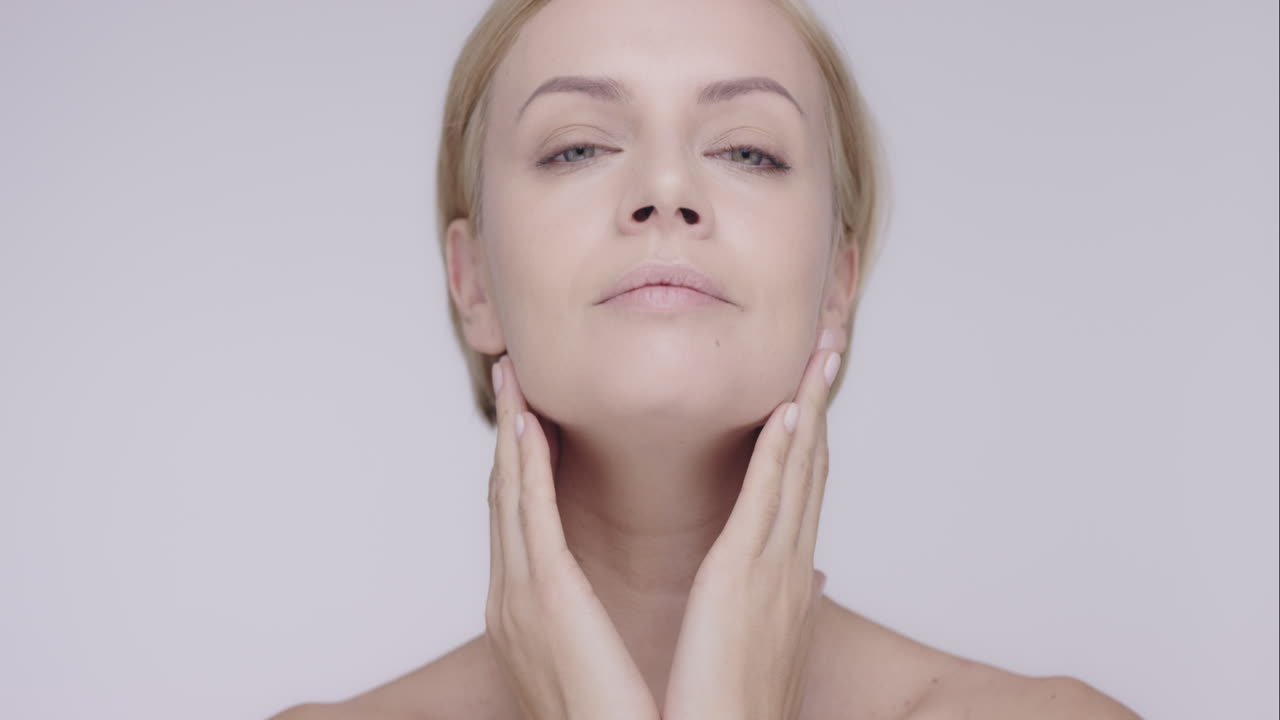 Premium stock video - Beautiful healthy woman touching smooth skin on ...
