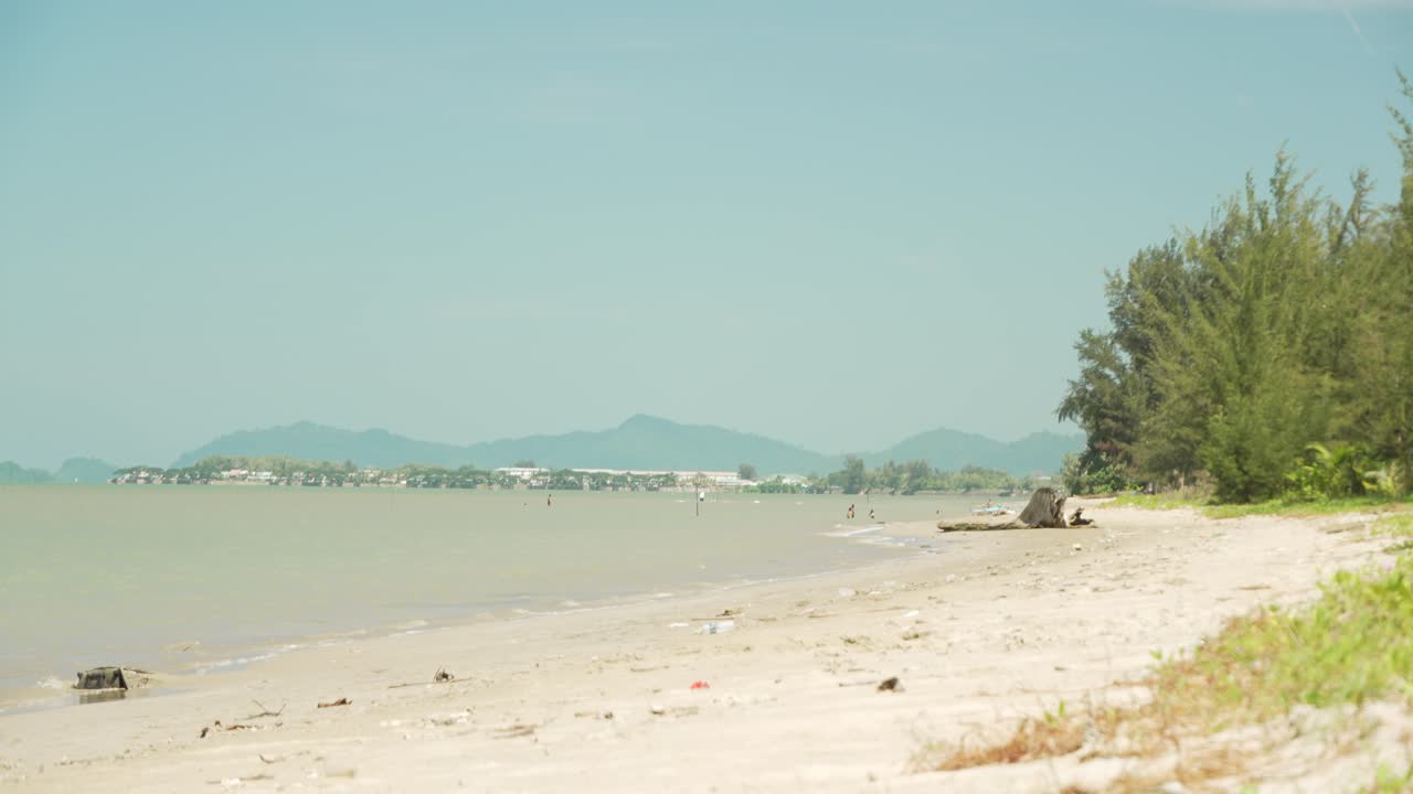 Lok Kawi Beach The Beach Sits Near Residentail Zone,With Its Shoreline Sea,Beds,Good For Casual Beach Time,During Sunset,With White Sandy Beach,Blue Sea Facing Few Island To The South China Sea