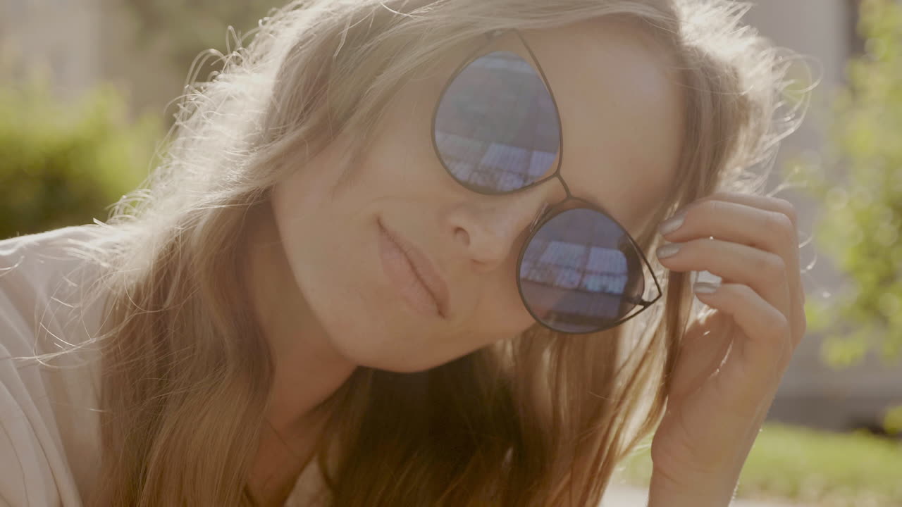 Woman with sunglasses in a park