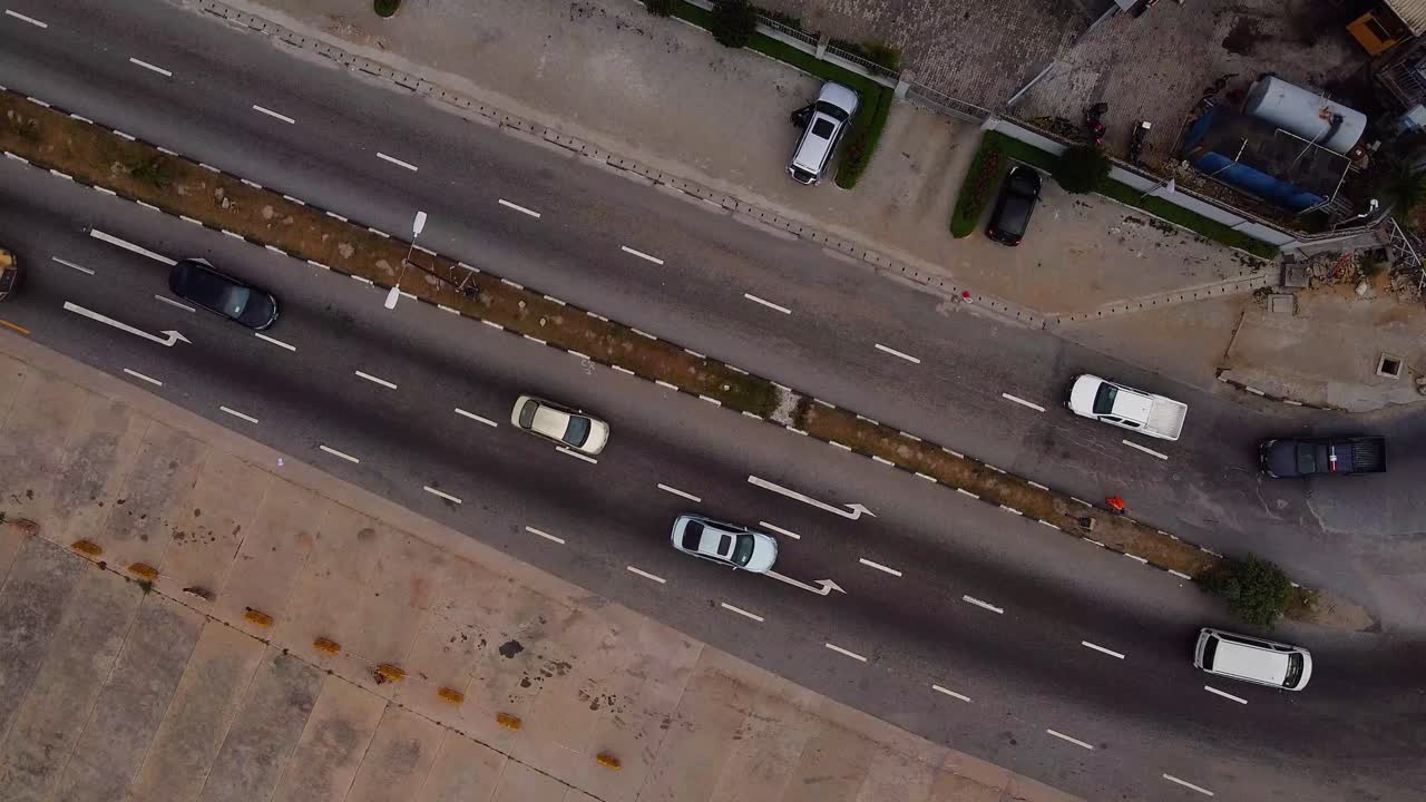 aerial shot of cars on an asphalt road