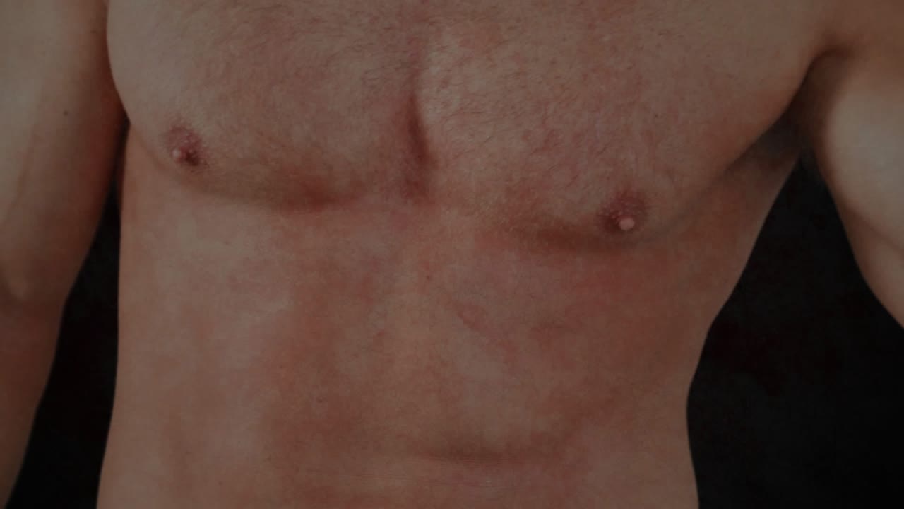 Fitness model flexing biceps against studio-lit bg, causing vein overlay fading, showing muscle