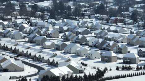 Aerial-view-of-a-cookie-cutter-USA-neighborhood-with-snow